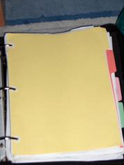 A binder with dividers.